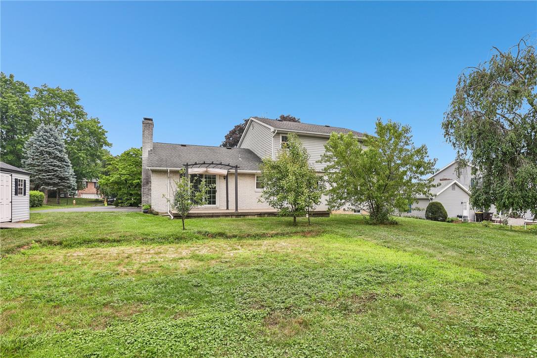3659 Ironstone Road Bethlehem, PA 18020 - Photo 36 of 52 A spacious lawn unfolds behind this home, offering a tranquil outdoor retreat.