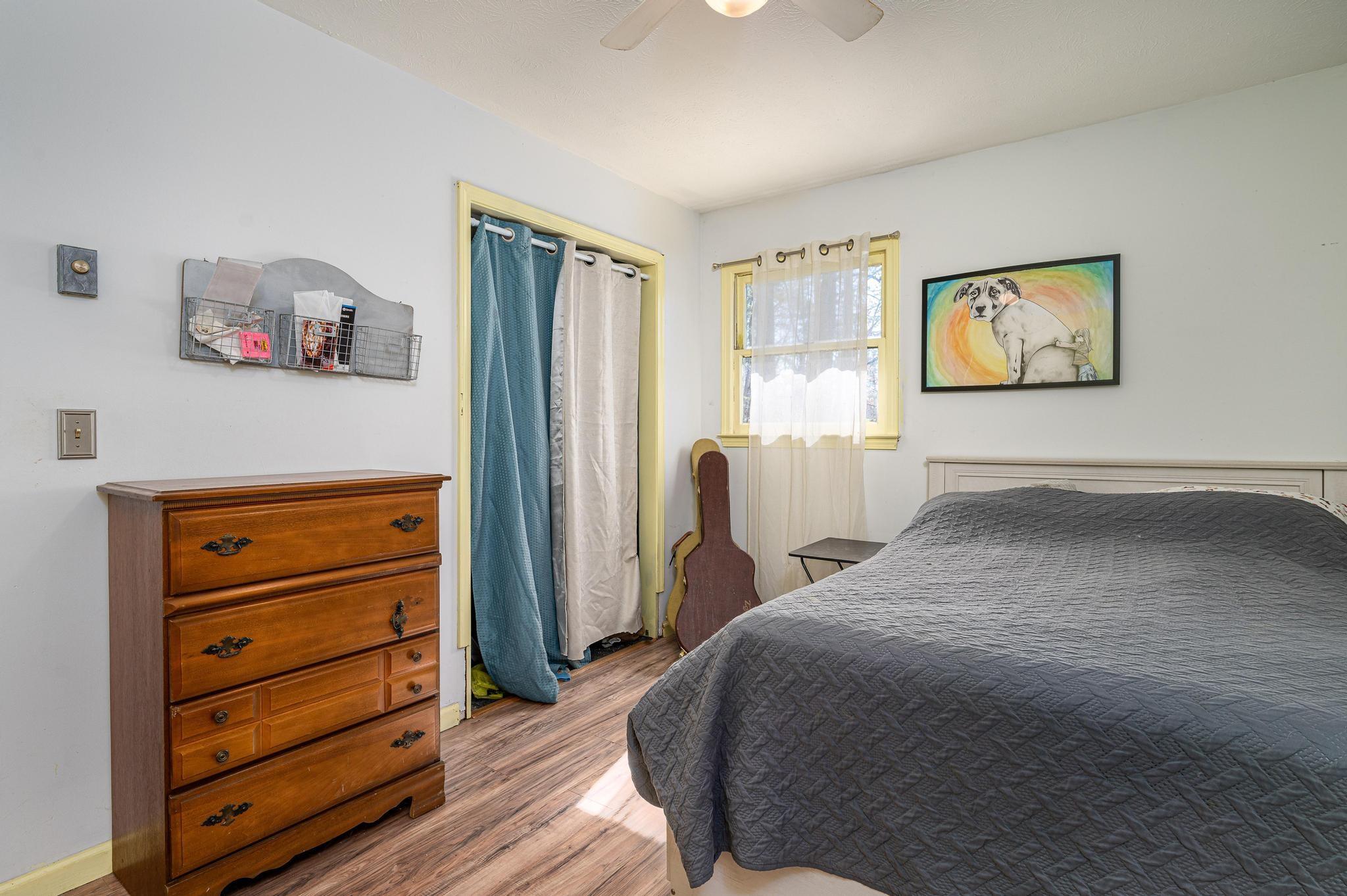 2 Laurel Brook Drive Flat Rock, NC 28731 - Photo 11 of 32 a bedroom with a bed and a dresser