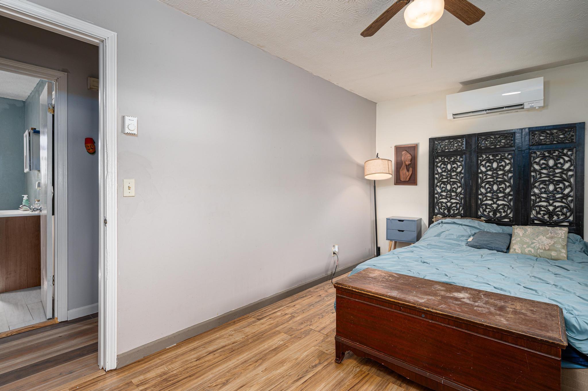 2 Laurel Brook Drive Flat Rock, NC 28731 - Photo 14 of 32 a room with a bed and a chandelier
