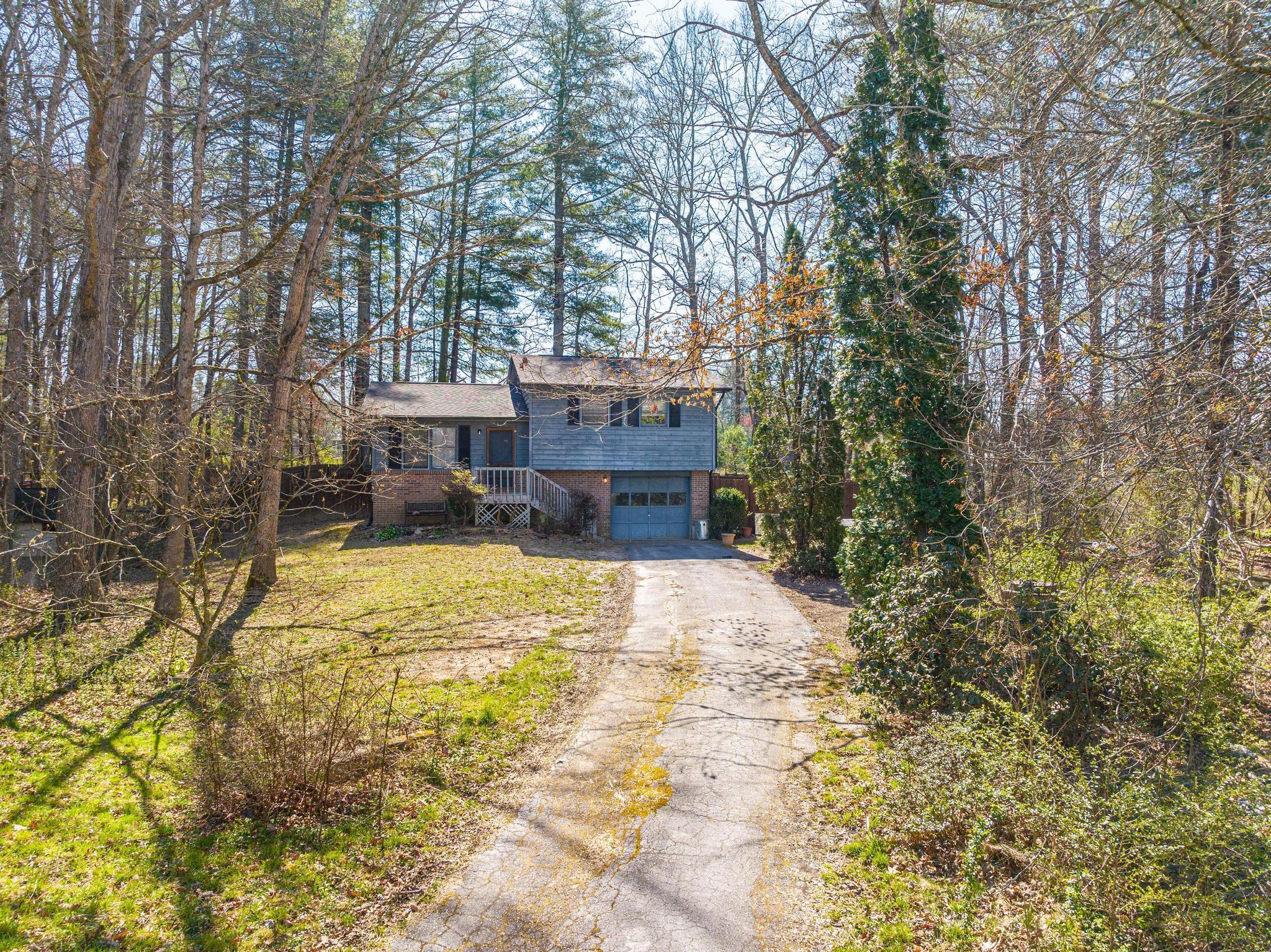 2 Laurel Brook Drive Flat Rock, NC 28731 - Photo 2 of 32 a swimming pool with yard and trees in the background