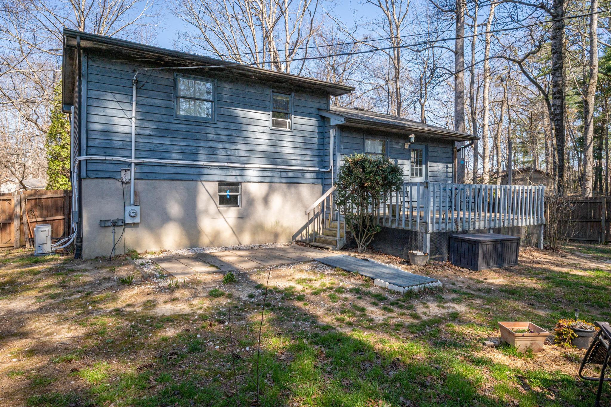 2 Laurel Brook Drive Flat Rock, NC 28731 - Photo 24 of 32 a backyard of a house with table and chairs
