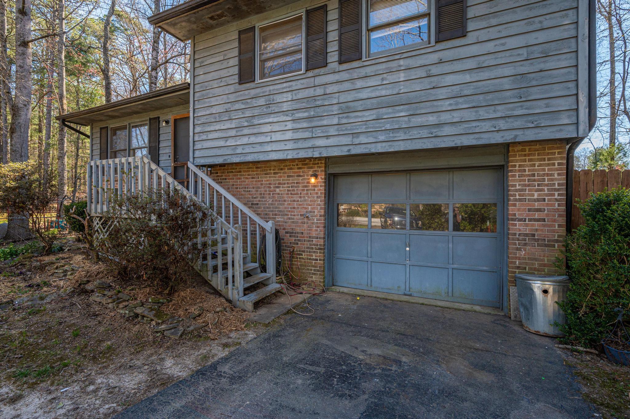 2 Laurel Brook Drive Flat Rock, NC 28731 - Photo 5 of 32 a view of house with a yard and potted plants