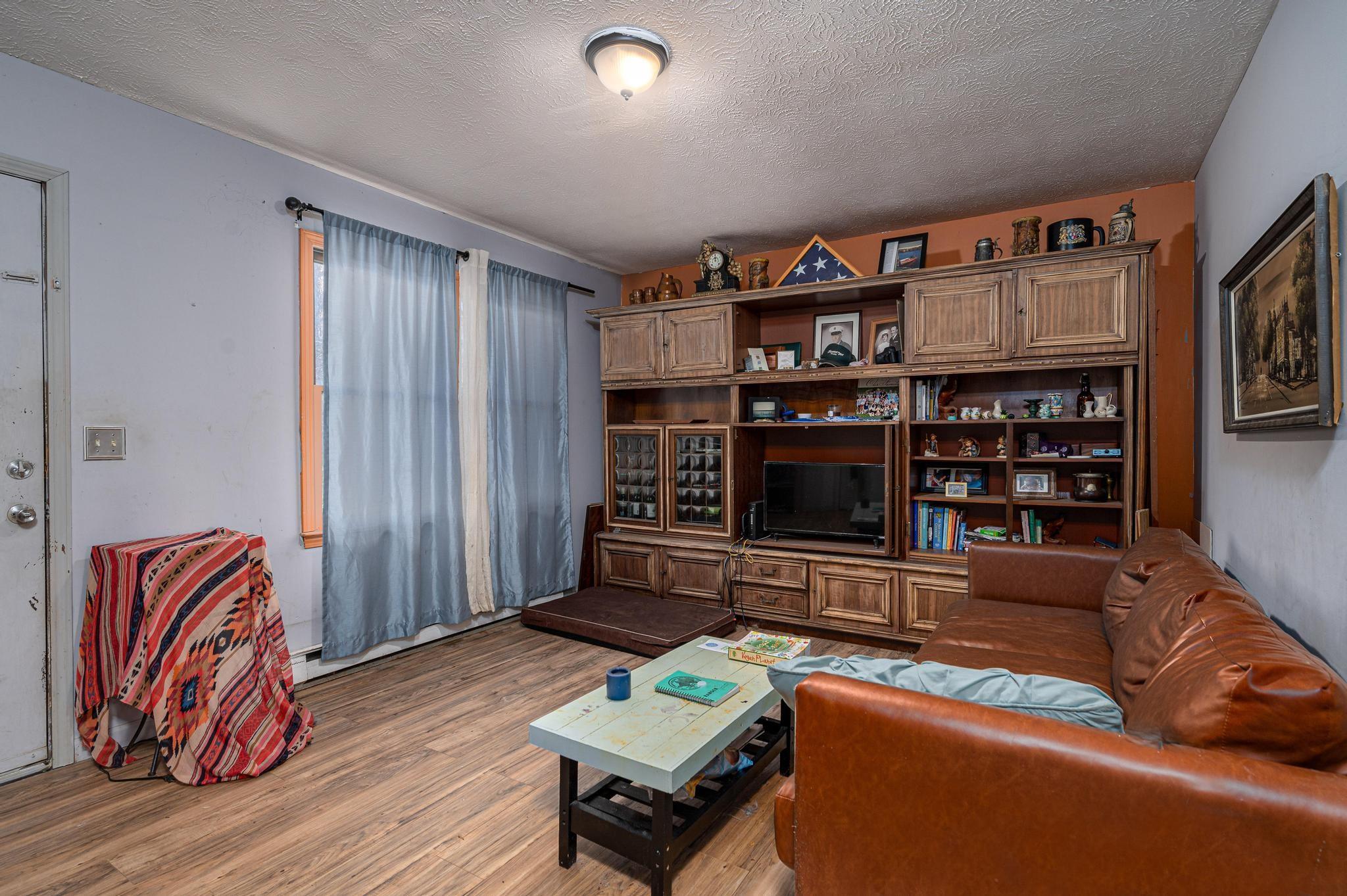 2 Laurel Brook Drive Flat Rock, NC 28731 - Photo 7 of 32 a living room with furniture and a book shelf