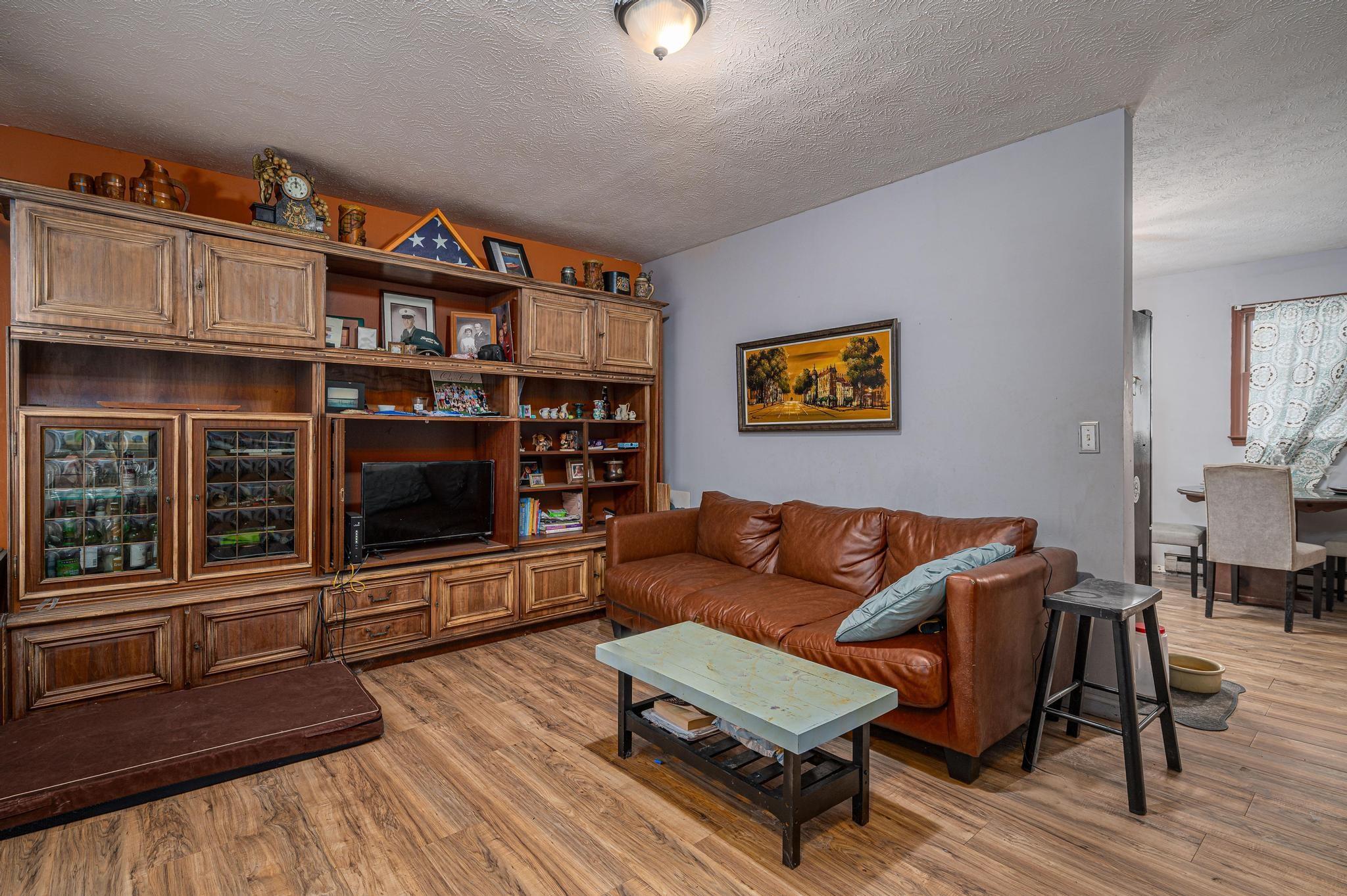 2 Laurel Brook Drive Flat Rock, NC 28731 - Photo 8 of 32 a living room with furniture a rug and a window