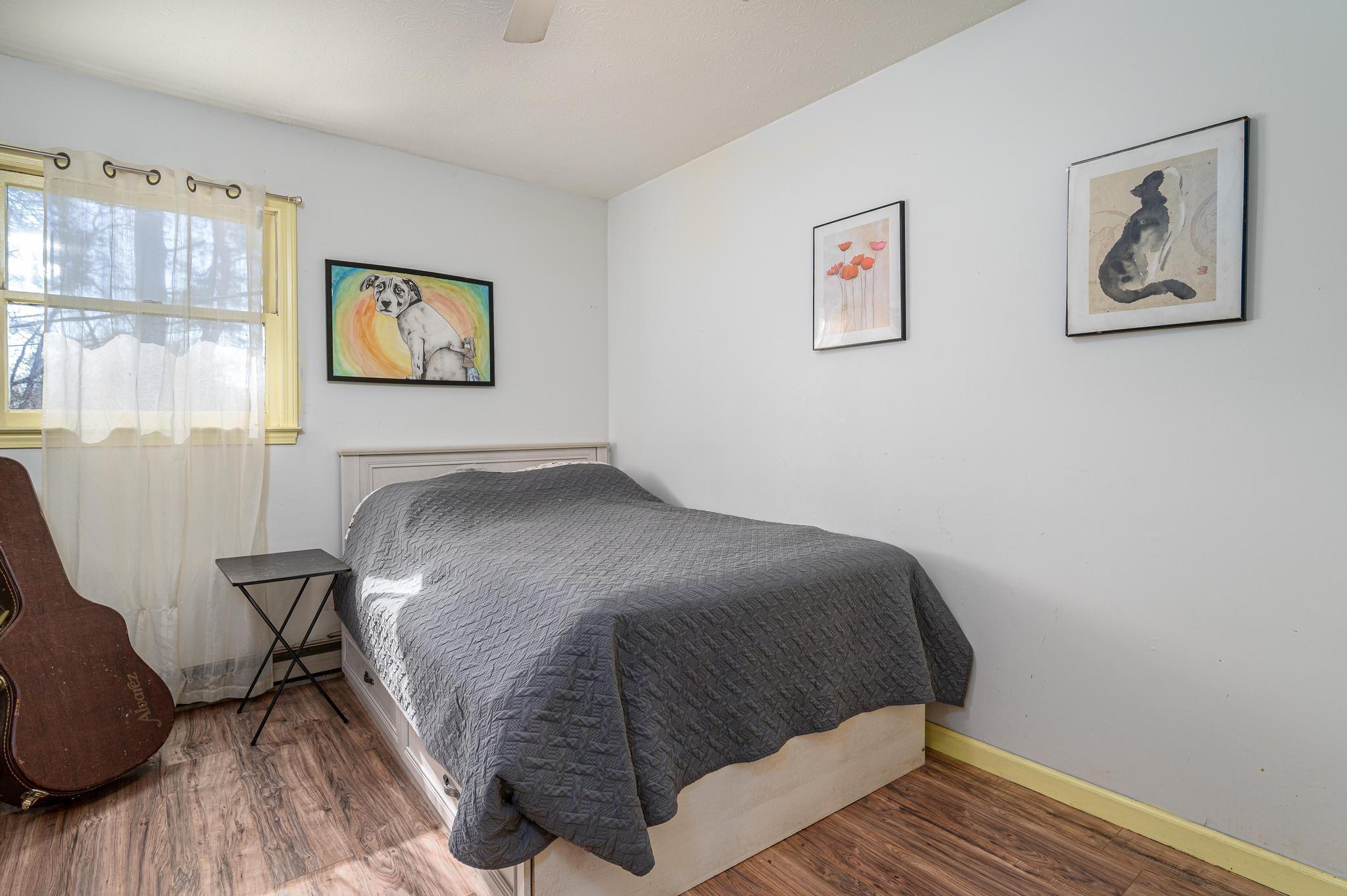 2 Laurel Brook Drive Flat Rock, NC 28731 - Photo 10 of 32 a bedroom with a bed and wooden floor