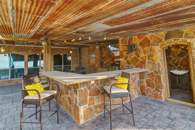 a view of an chairs and table in the patio