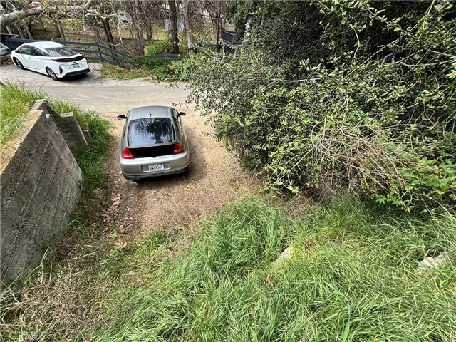 a car parked in the middle of a field
