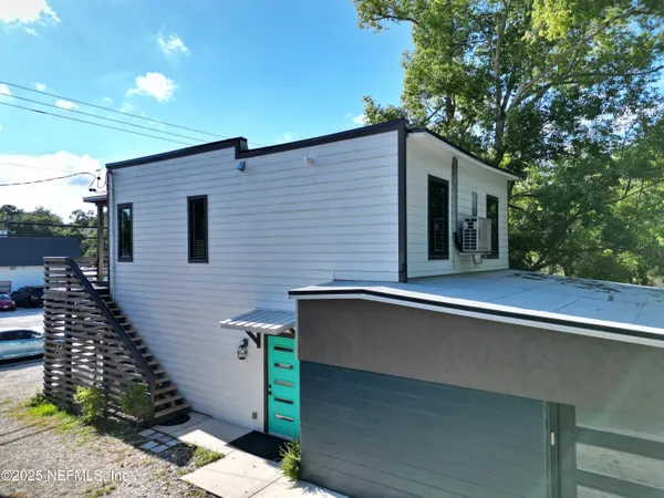 a backyard of a house with seating space