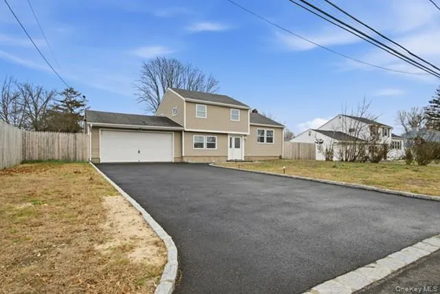 a large tree in front of a house