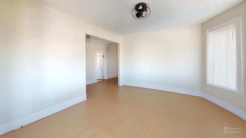 1161 Commonwealth Avenue, Unit 8 Boston, MA 02134 - Photo 6 of 17 an empty room with a window