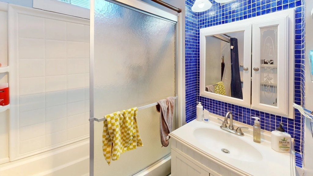 1161 Commonwealth Avenue, Unit 8 Boston, MA 02134 - Photo 7 of 17 a bathroom with a sink and mirror