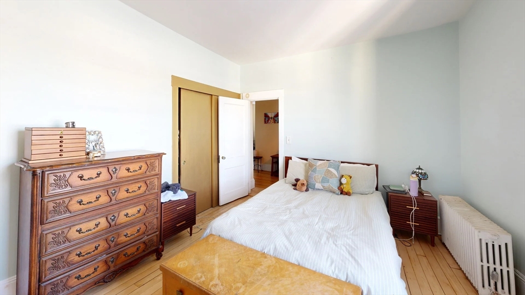 1161 Commonwealth Avenue, Unit 8 Boston, MA 02134 - Photo 8 of 17 a bed room with a bed and a closet