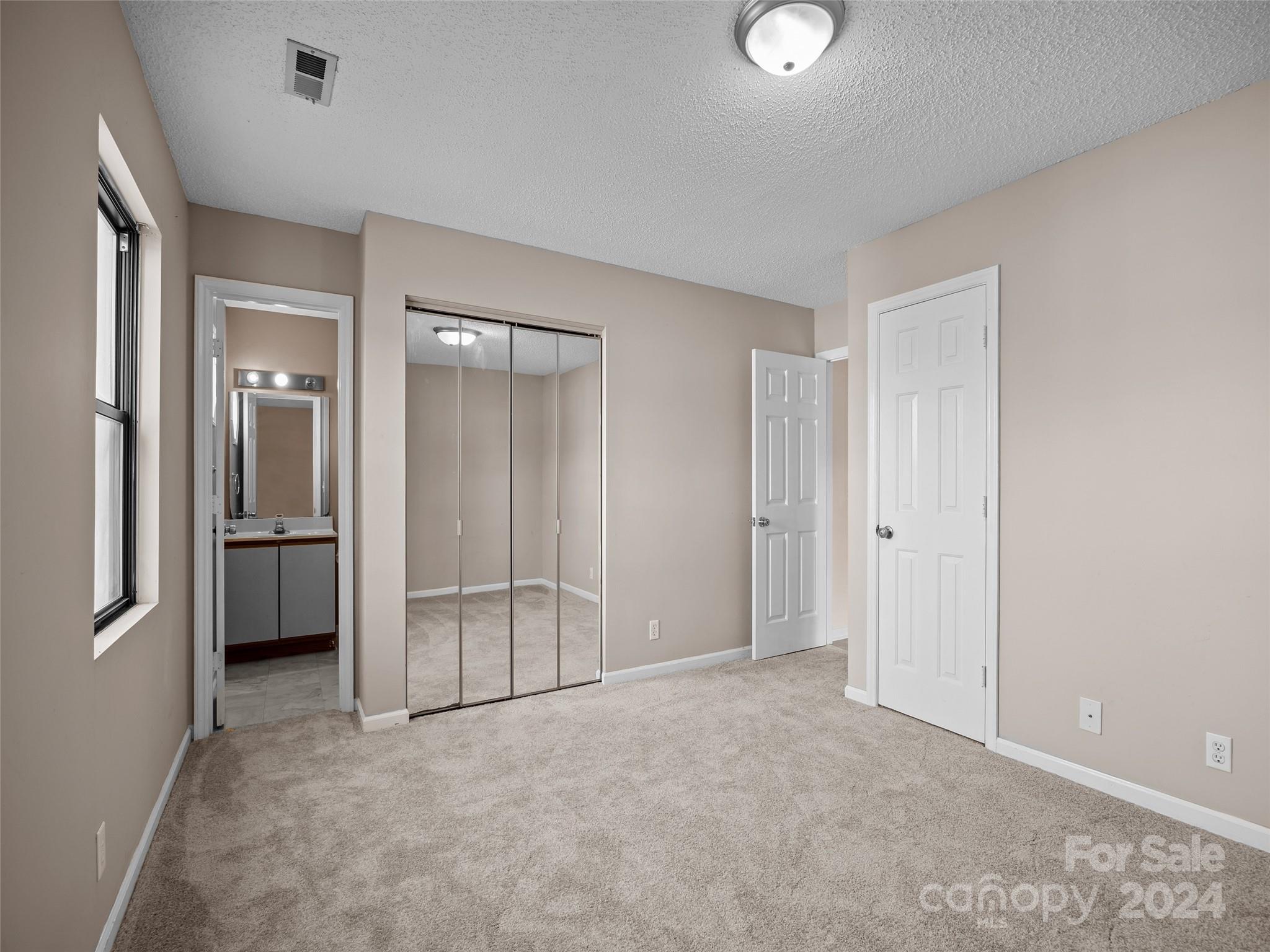 110 Heywood Road, Unit 14D Arden, NC 28704 - Photo 14 of 20 a view of an empty room and a window