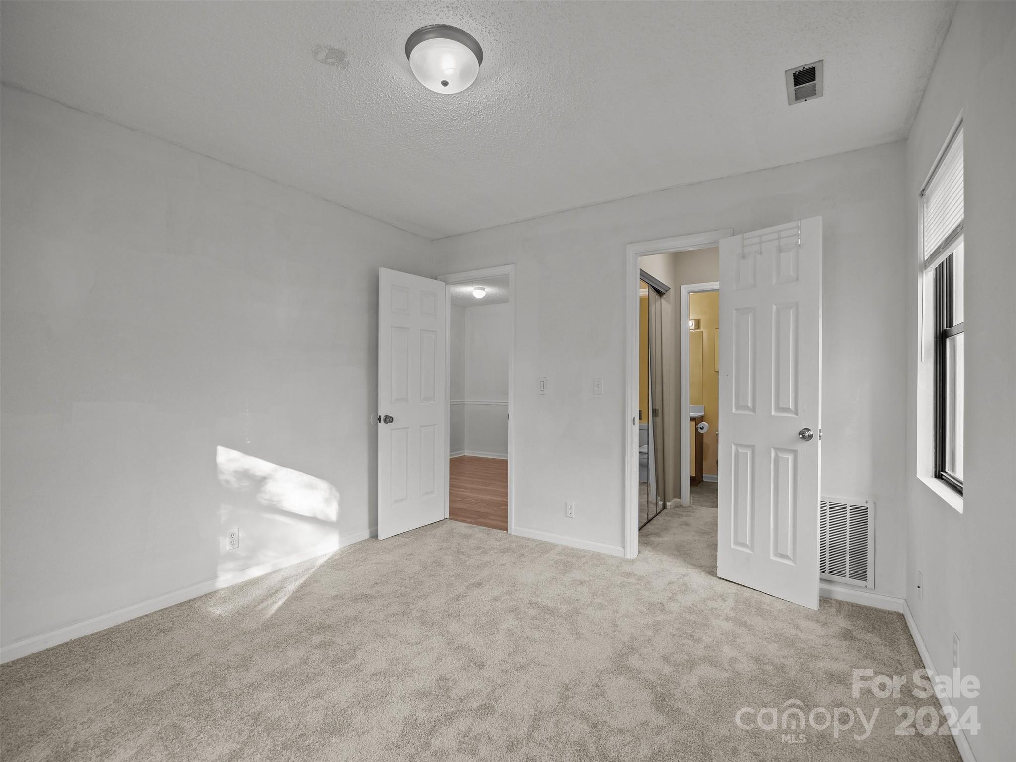 110 Heywood Road, Unit 14D Arden, NC 28704 - Photo 10 of 20 wooden floor in an empty room
