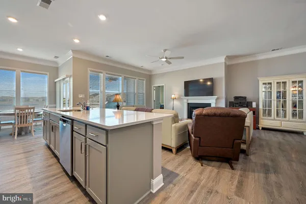 a kitchen with a sink appliances and a counter top space