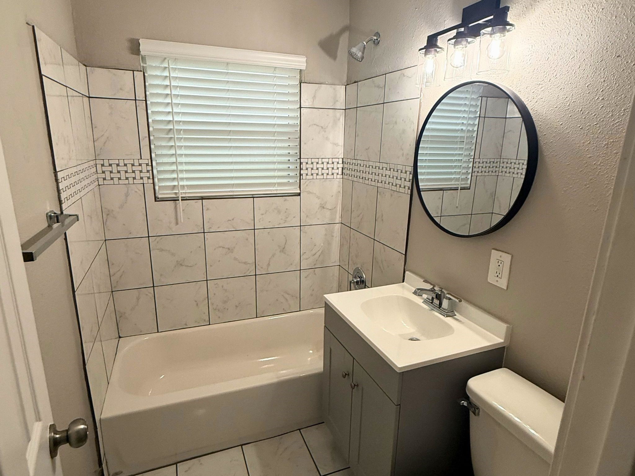 5142 Balkin Street Houston, TX 77021 - Photo 9 of 12 a bathroom with a sink and a mirror