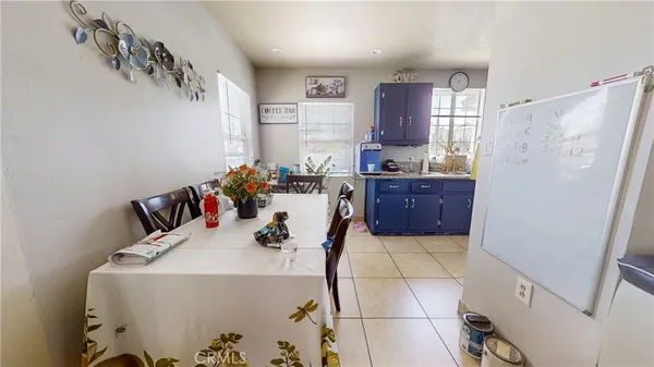 a kitchen with stainless steel appliances a refrigerator and a stove