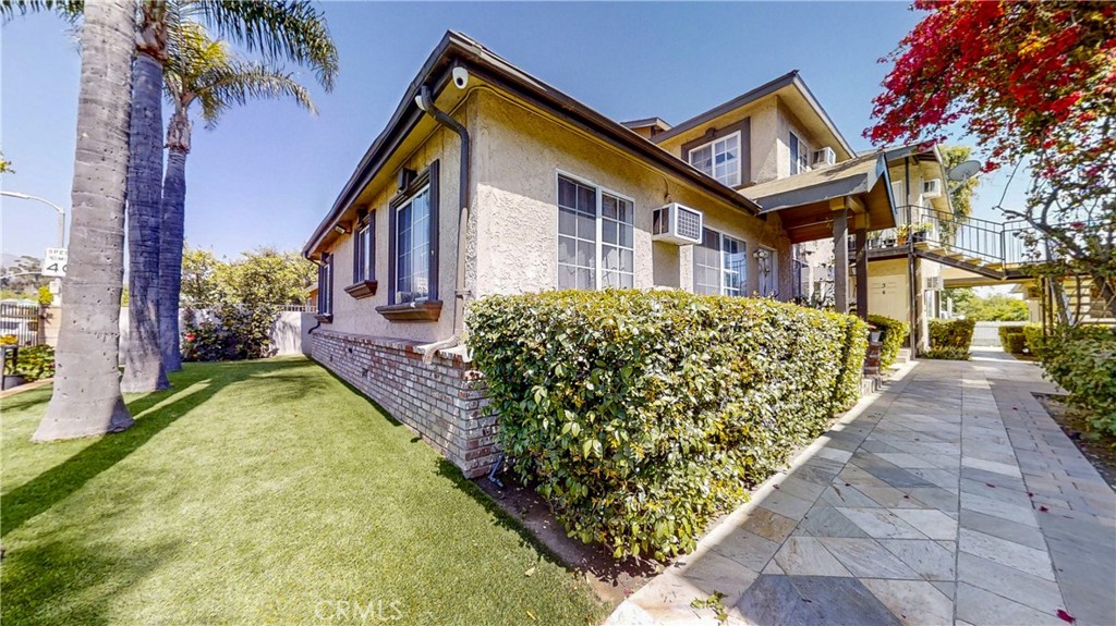 13226 Paxton Street Pacoima, CA 91331 - Photo 6 of 27 a front view of a house with garden