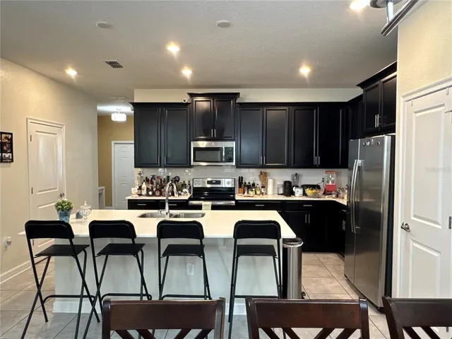 a white toilet sitting next to a shower