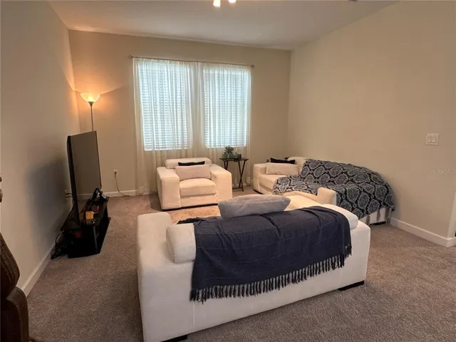 a bed room with a bed and a couch