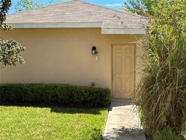 a view of a swimming pool with a chair and tables