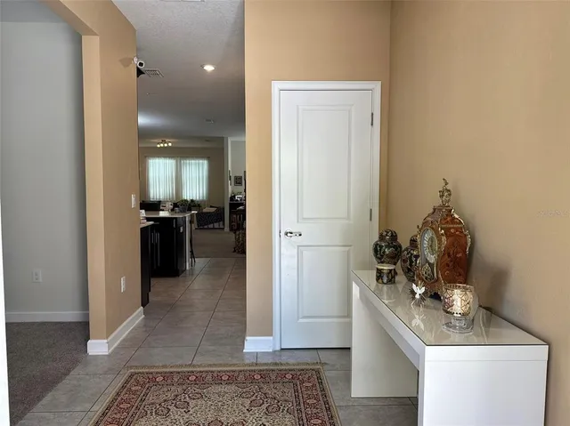 a view of a hallway and dining room