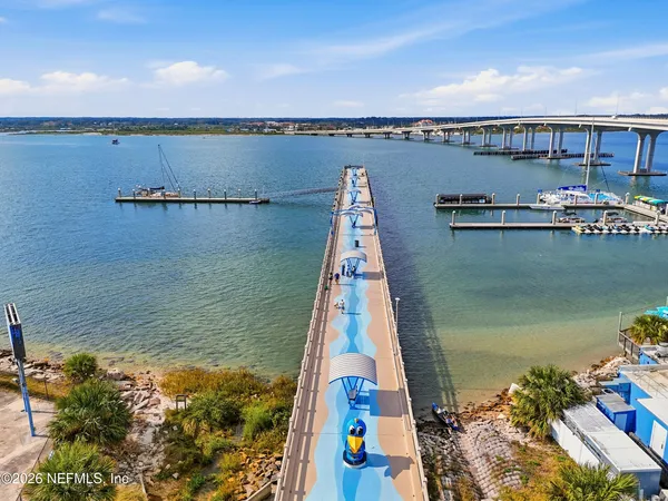 an aerial view of a house with a lake view