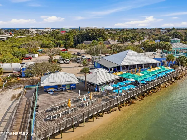 a view of a room with table and chairs