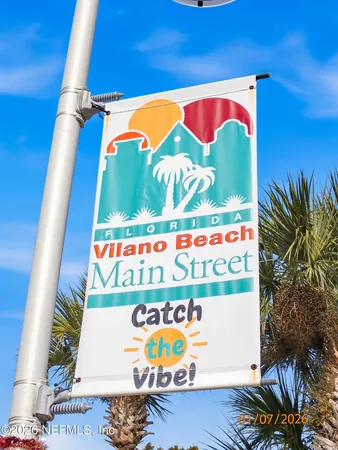 a view of a patio with a table and chairs