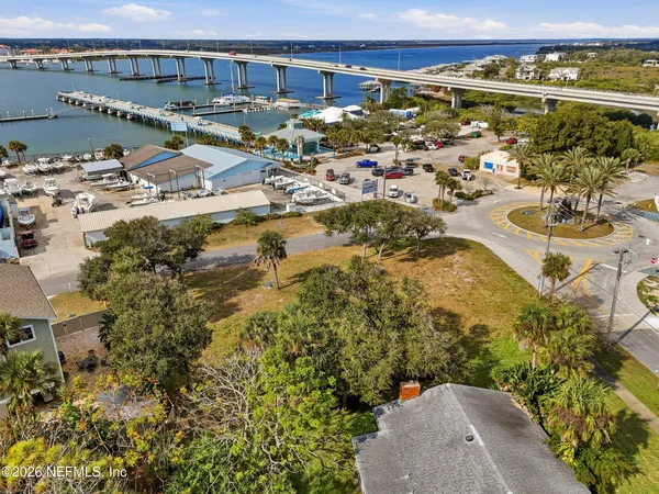a view of a swimming pool with an outdoor seating and a garden