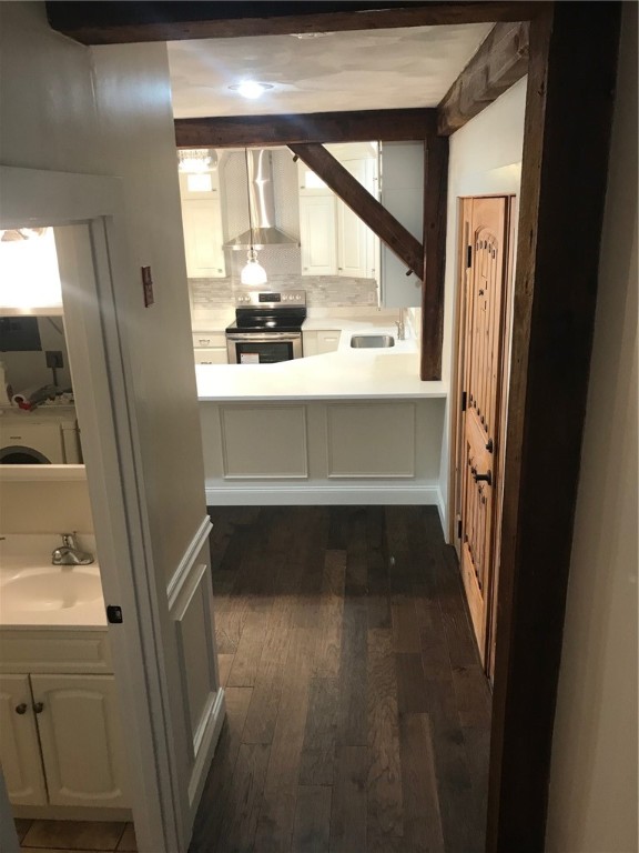 78 Dexter Road Scituate, RI 02857 - Photo 8 of 24 View from the staircase showing the half bathroom and Kitchen