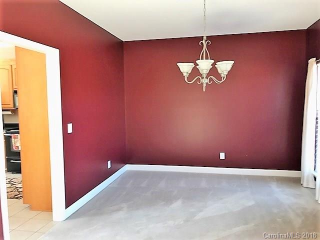 211 Trinity Church Road Monroe, NC 28112 - Photo 13 of 27 a view of a room with a chandelier fan