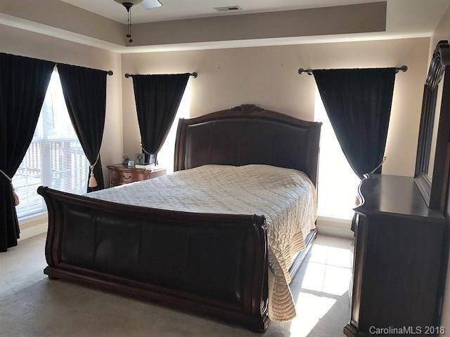 211 Trinity Church Road Monroe, NC 28112 - Photo 18 of 27 a bed sitting in a bedroom next to a window