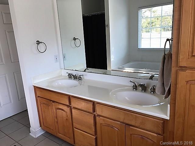 211 Trinity Church Road Monroe, NC 28112 - Photo 20 of 27 a bathroom with a sink double vanity and a mirror