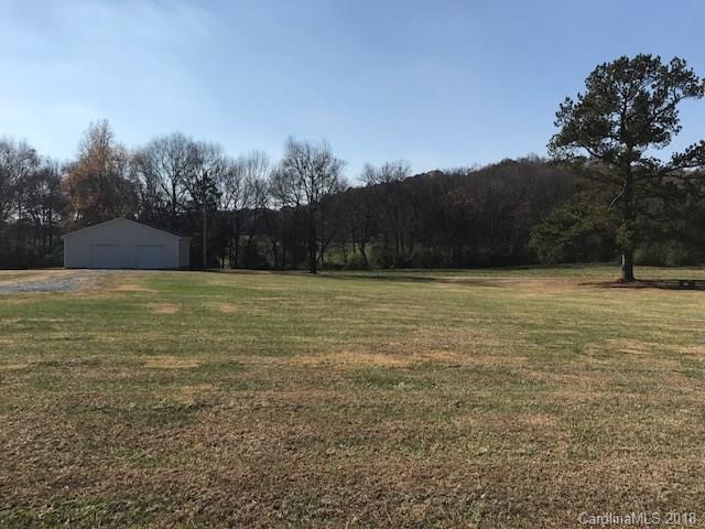 211 Trinity Church Road Monroe, NC 28112 - Photo 27 of 27 a view of a yard with a house in the background