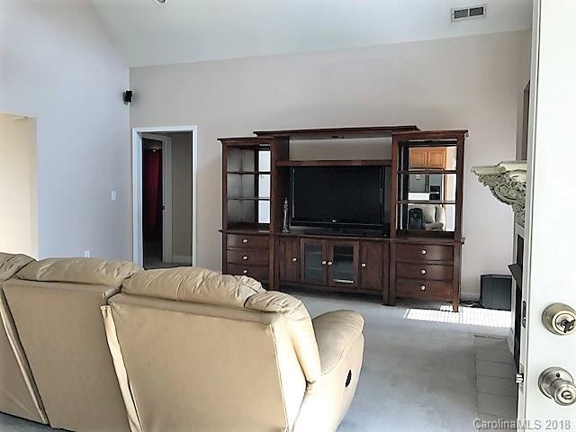 211 Trinity Church Road Monroe, NC 28112 - Photo 9 of 27 a living room with furniture and a flat screen tv