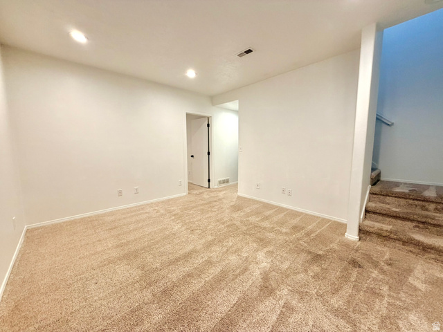 11895 Inauguration Road Draper, UT 84020 - Photo 11 of 13 Carpeted room with recessed lighting, white baseboards, and a doorway opening into a separate area