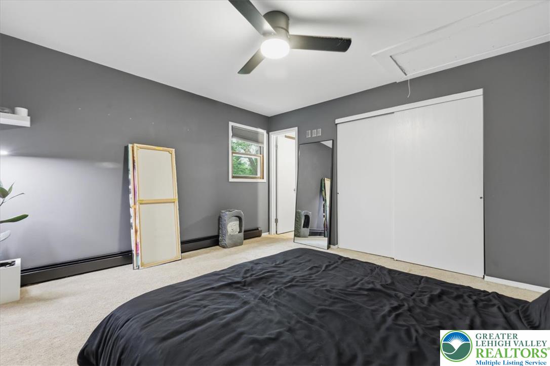 520 Highland Hill Road Jim Thorpe, PA 18235 - Photo 28 of 83 Well-lit sleeping quarters with a ceiling fan, closet, and carpeted floor provide comfort.