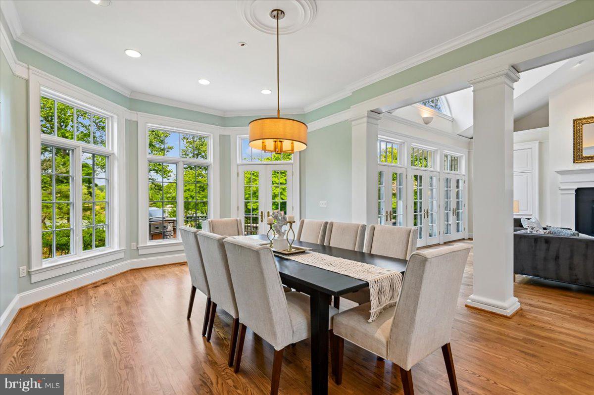 2700 Falling Timber Trail Edgewater, MD 21037 - Photo 16 of 89 a view of a dining room with furniture window and wooden floor