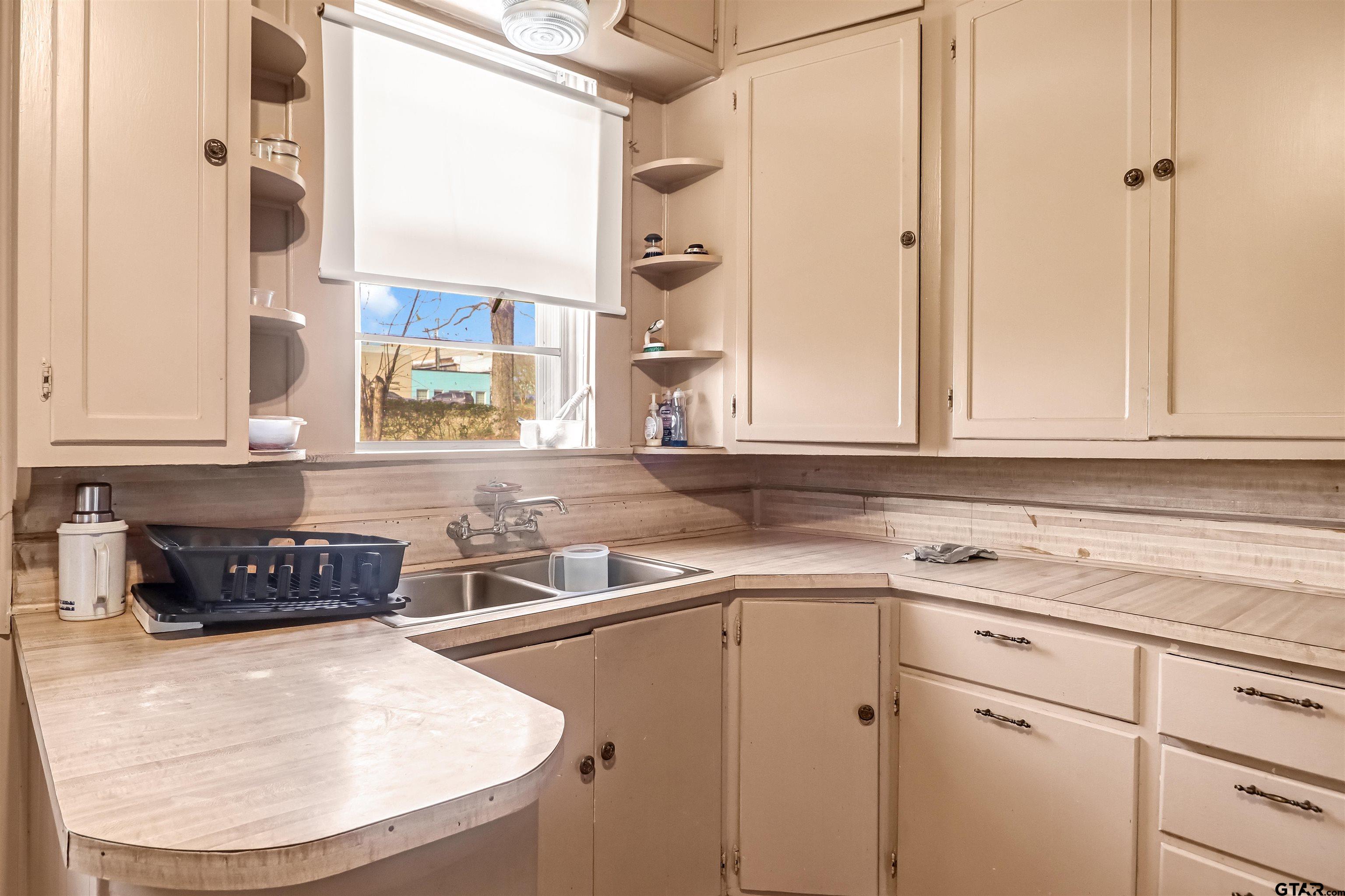 205 East 4th Street Rusk, TX 75785 - Photo 12 of 23 a kitchen with a sink and cabinets