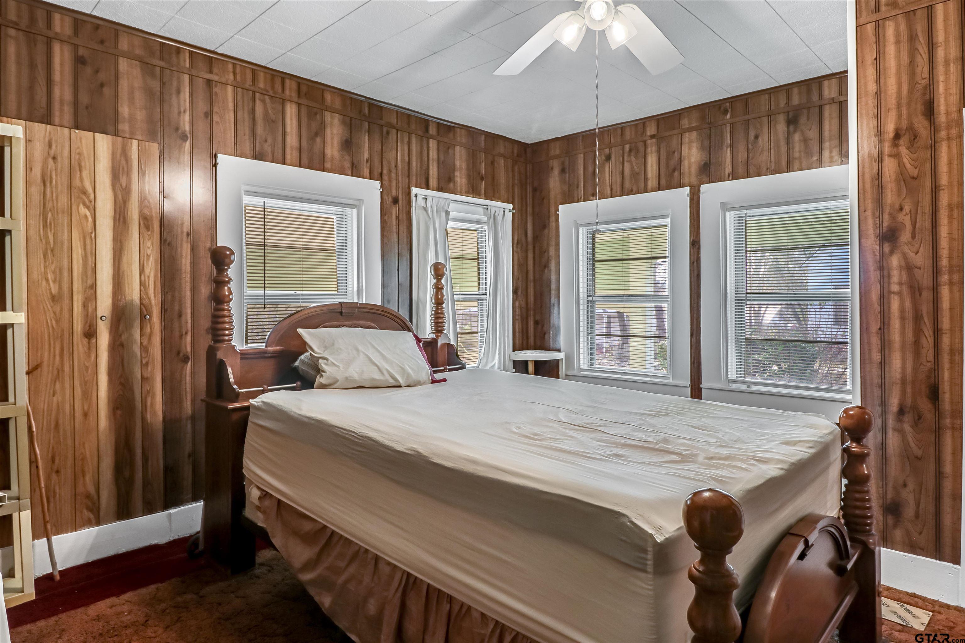 205 East 4th Street Rusk, TX 75785 - Photo 15 of 23 a bedroom with a bed and a table