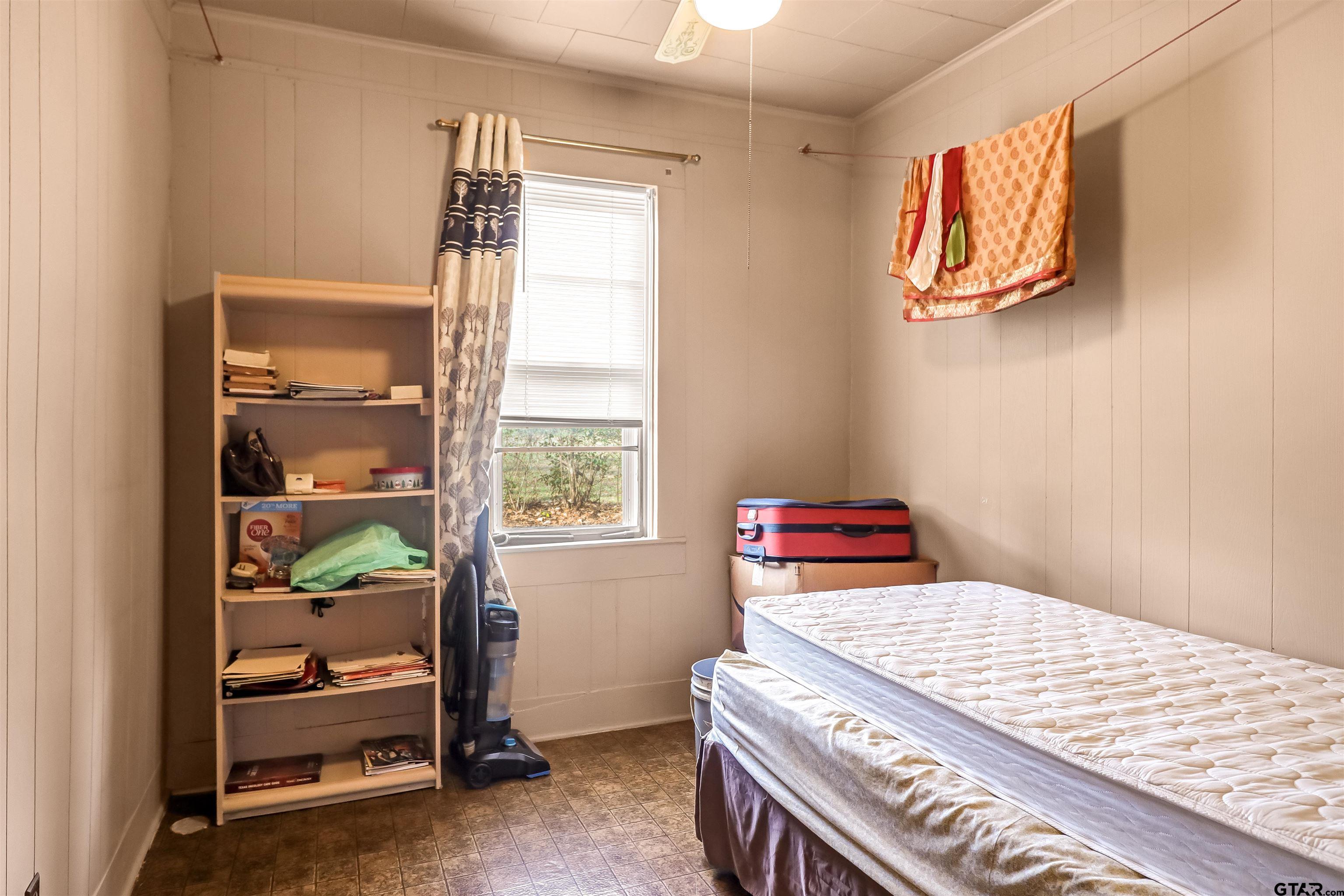205 East 4th Street Rusk, TX 75785 - Photo 18 of 23 a bedroom with a bed and a window