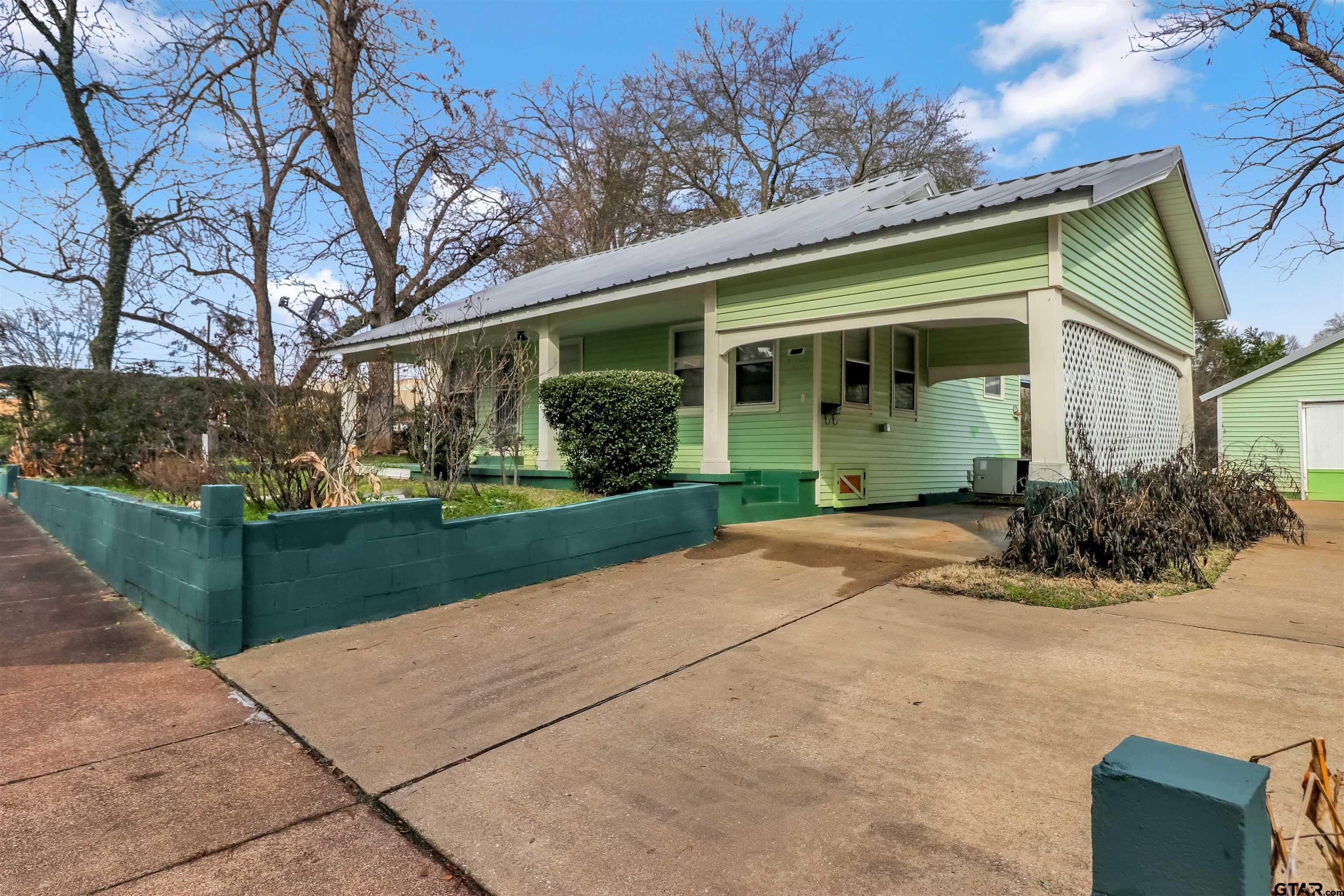 205 East 4th Street Rusk, TX 75785 - Photo 2 of 23 a front view of a house with garden