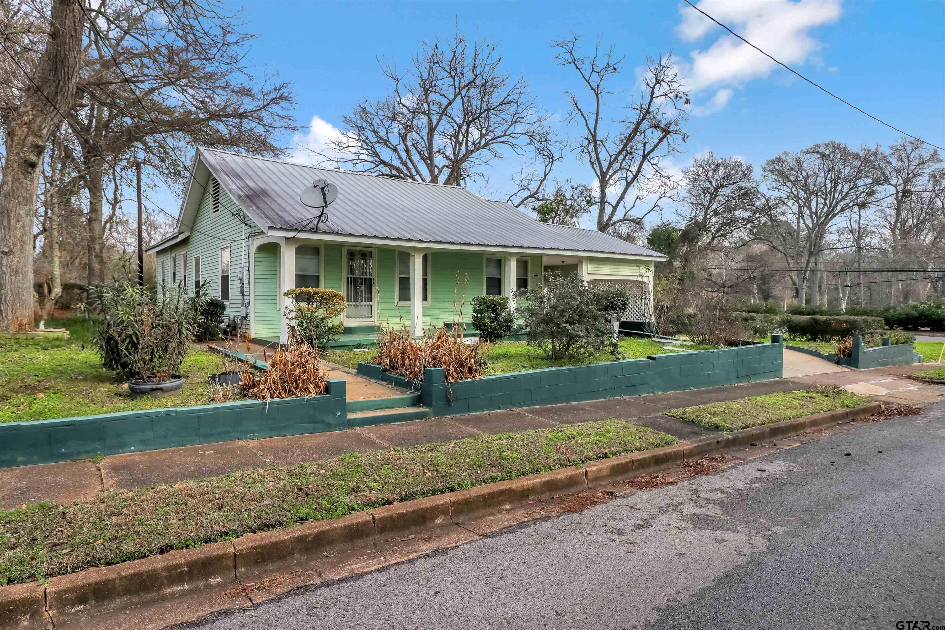 205 East 4th Street Rusk, TX 75785 - Photo 4 of 23 a front view of house with yard and green space