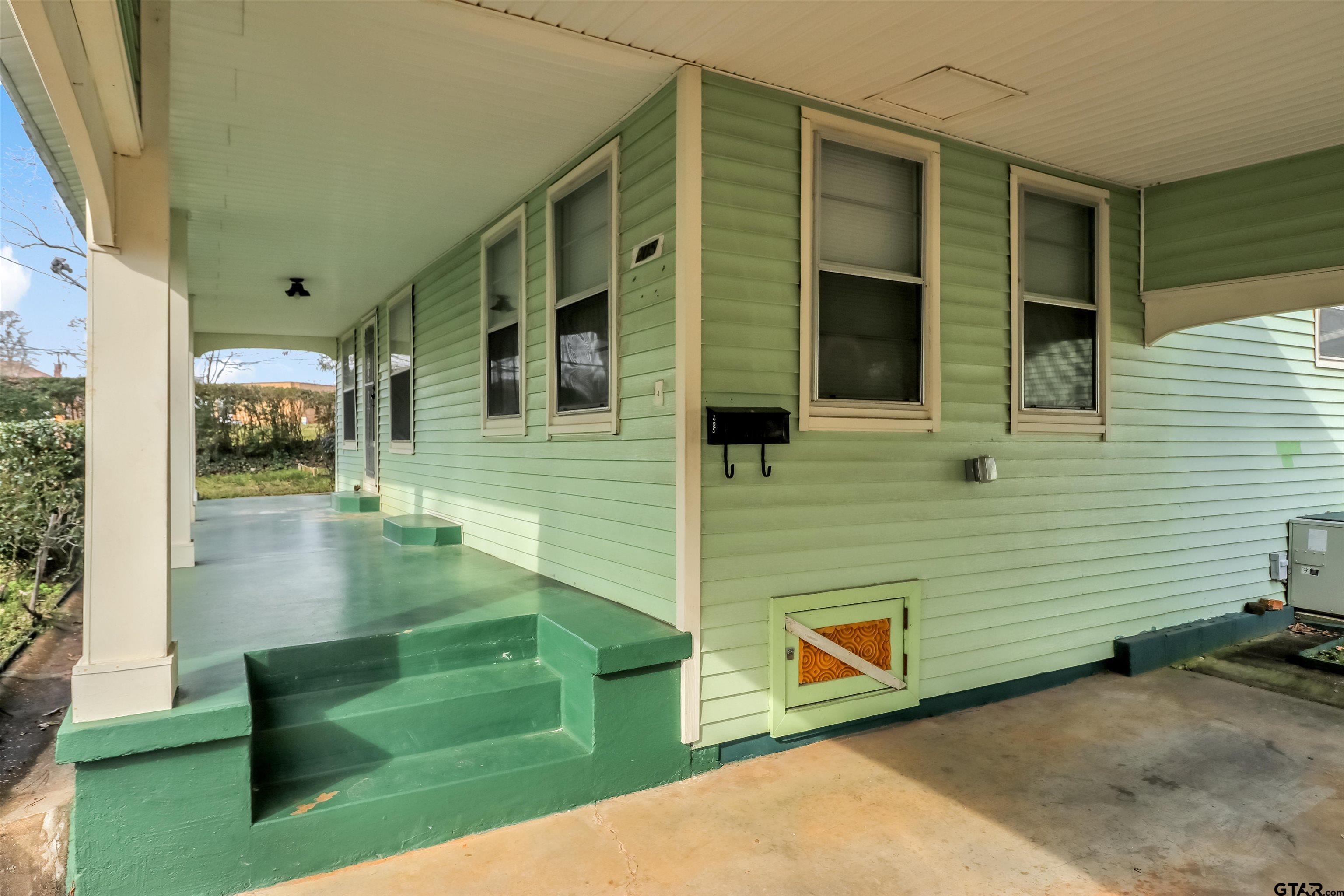 205 East 4th Street Rusk, TX 75785 - Photo 5 of 23 a front view of a house with a yard