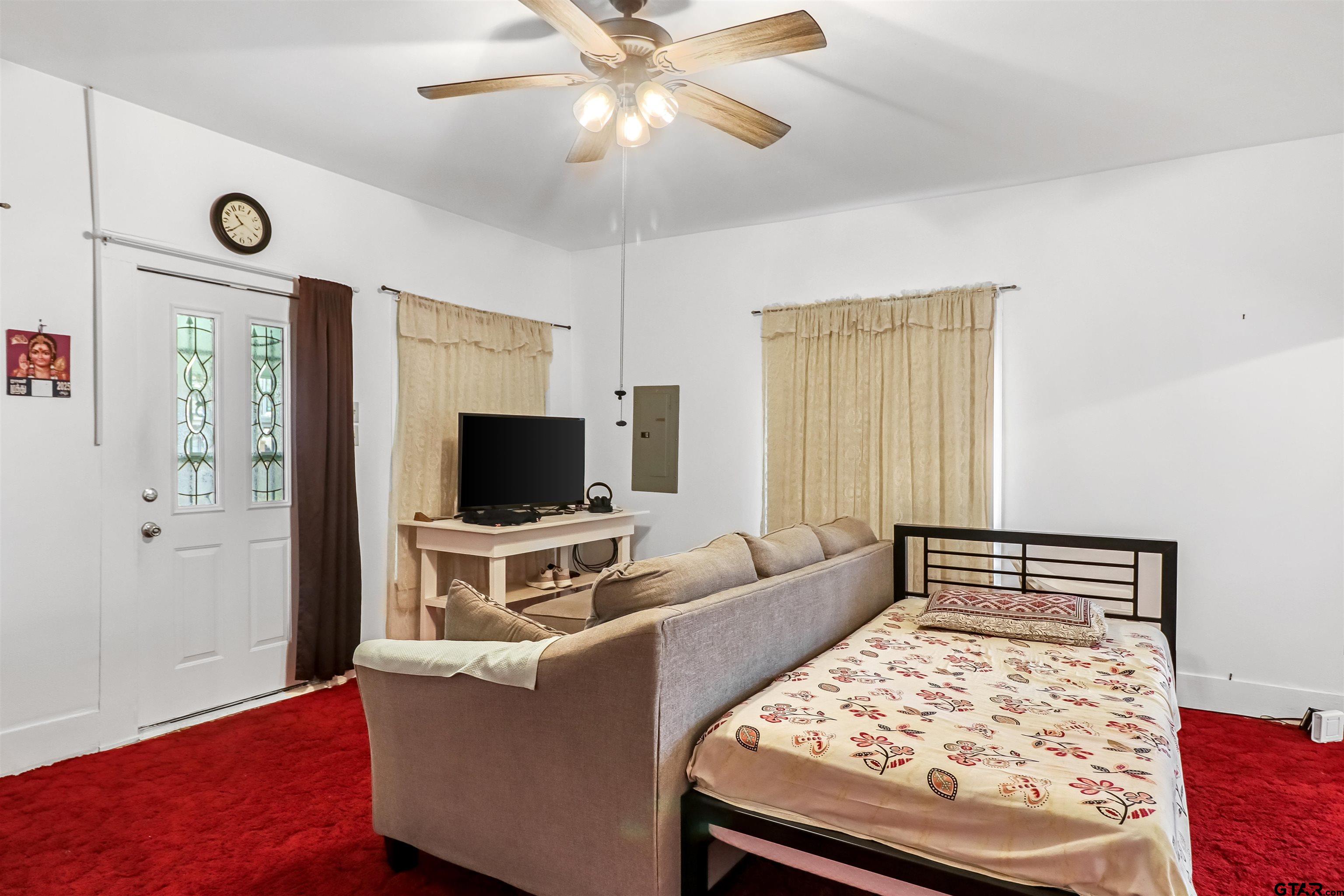 205 East 4th Street Rusk, TX 75785 - Photo 6 of 23 a living room with furniture and a flat screen tv