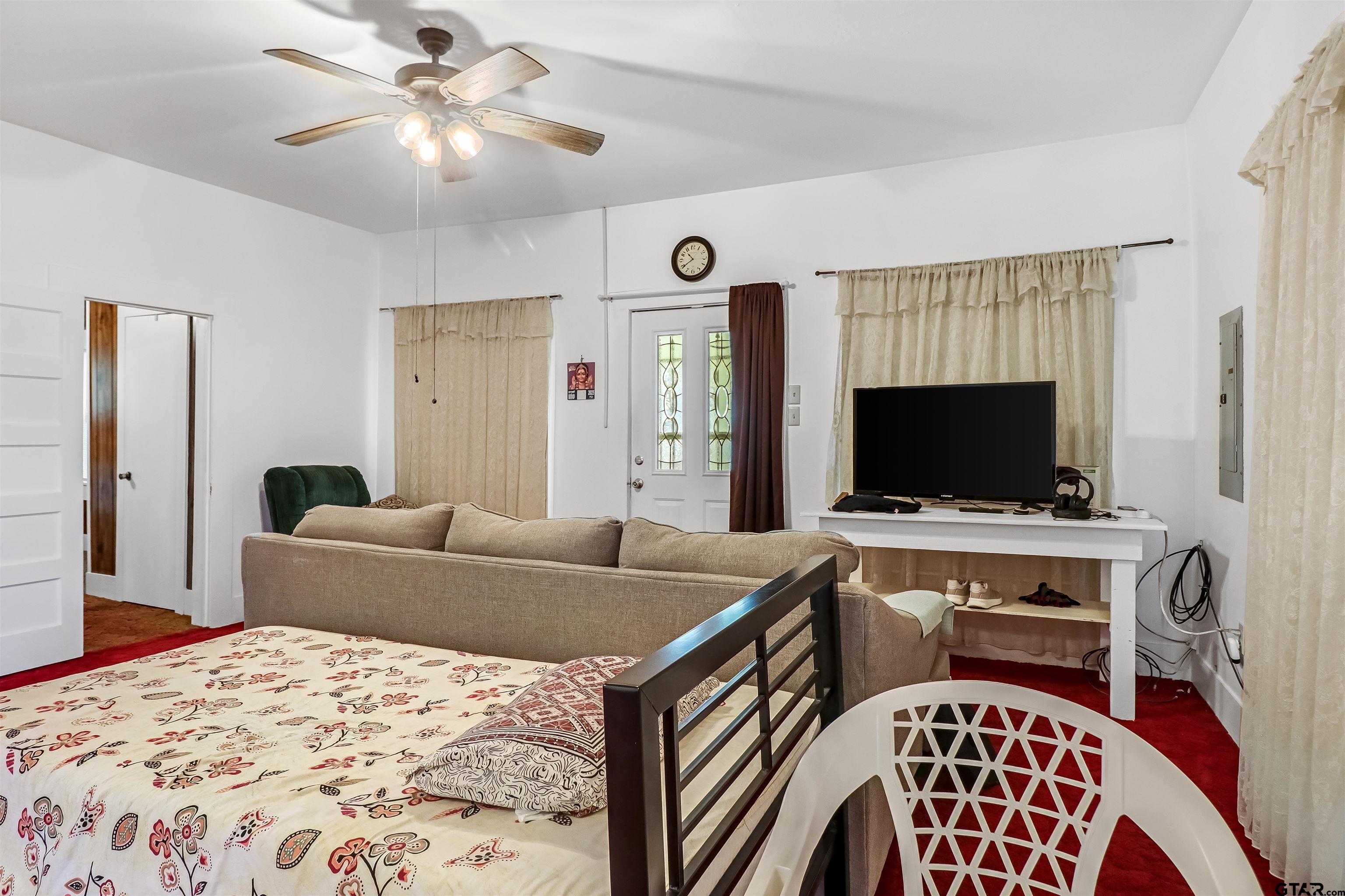 205 East 4th Street Rusk, TX 75785 - Photo 7 of 23 a living room with furniture and a flat screen tv