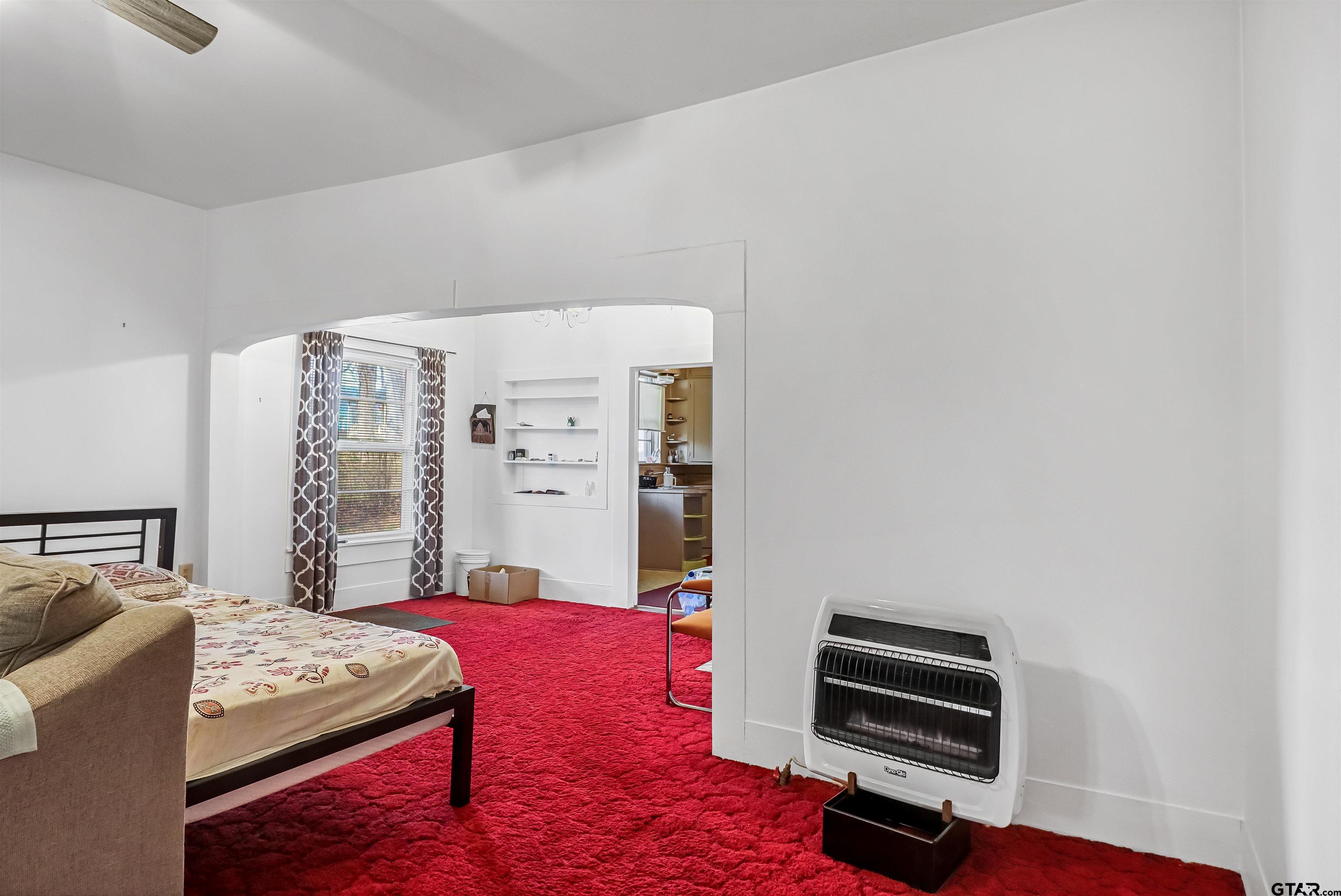 205 East 4th Street Rusk, TX 75785 - Photo 9 of 23 a bedroom with a bed and a window