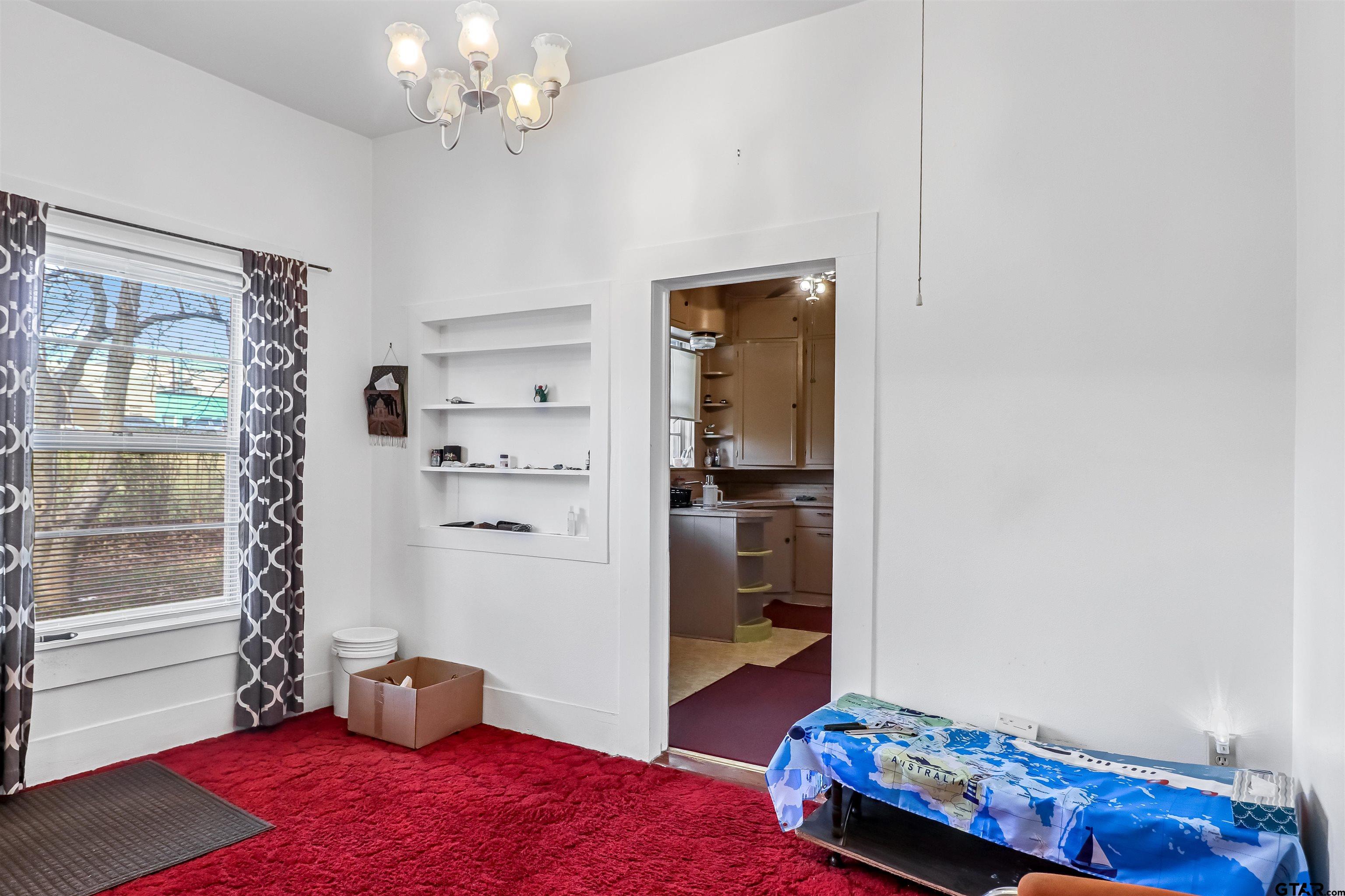 205 East 4th Street Rusk, TX 75785 - Photo 10 of 23 a living room with furniture and a window