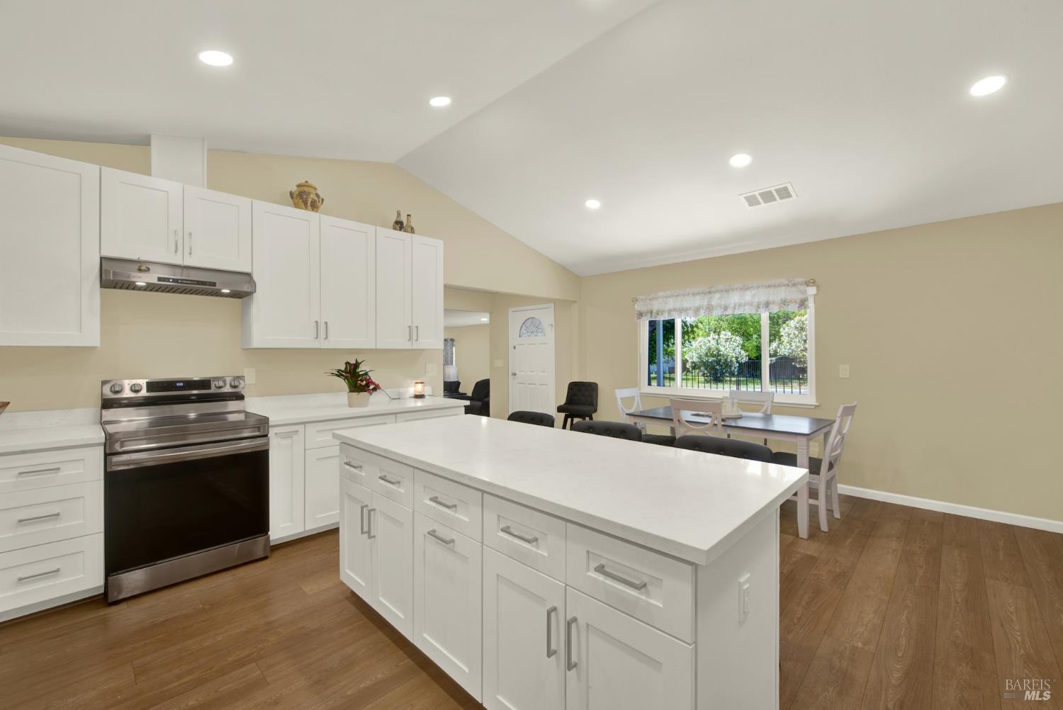 4851 Udell Road Vacaville, CA 95688 - Photo 12 of 65 a kitchen with a stove sink and cabinets